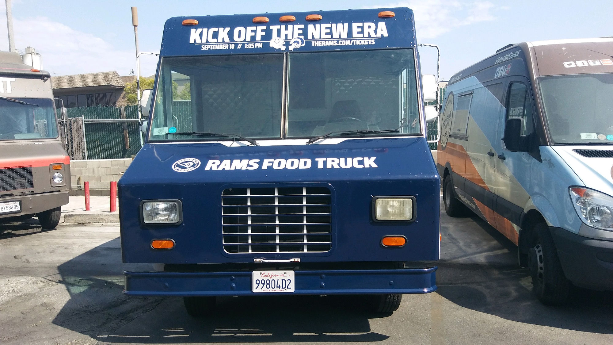 Los Angeles Rams branded food truck activation showing 'Kick Off the New Era' campaign signage and Rams Food Truck branding for the season opener at the LA Memorial Coliseum