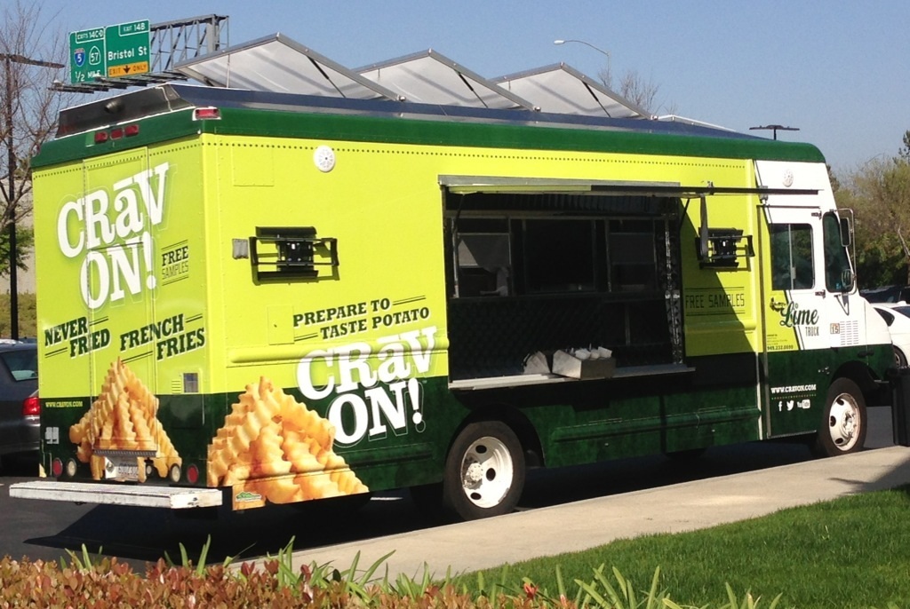 Simplot Crav'N Fresh branded food truck wrap by The Lime Truck — neon green vinyl with Prepare to Taste Potato messaging